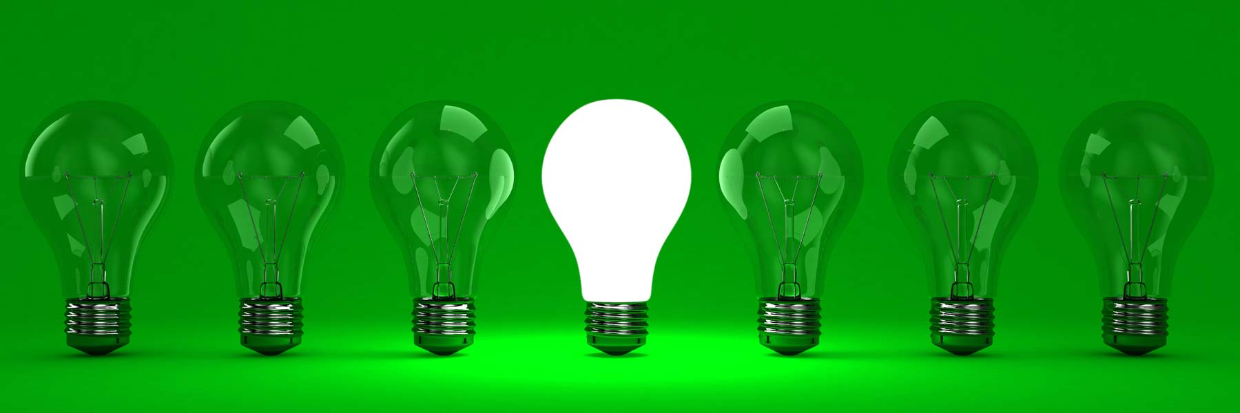 6 green lightbulbs and one white lightbulb in the middle, all on a green background